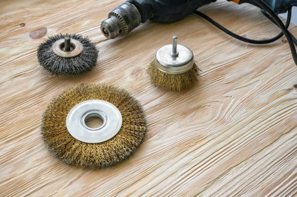 istock abrasive tools for brushing wood and giving it texture. Wire brushes on treated wood. Copy space 1170541676