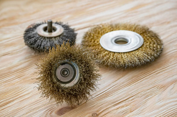 istock abrasive tools for brushing wood and giving it texture. Wire brushes on treated wood 1170541682