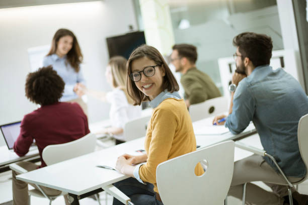 istock Young female student with eyeglasses in the classroom 1170542168