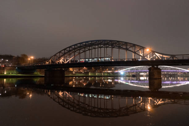 istock Pilsudski bridge and Bernatek footbridge at night in Krakow 1170544344