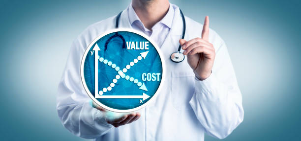 Young Clinician Advising On Cost Versus Value stock photo