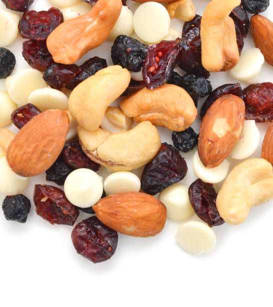 istock Mix nuts, dry fruits and chocolate on a white background 1170547633