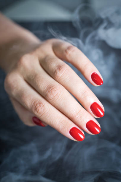 istock Female hand with a beautiful red manicure 1170556125