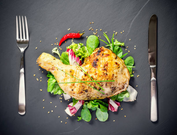 istock Grilled chicken thighs on slate plate 1170556438
