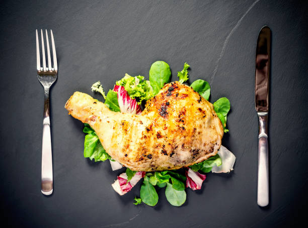 istock Grilled chicken thighs on slate plate 1170556506