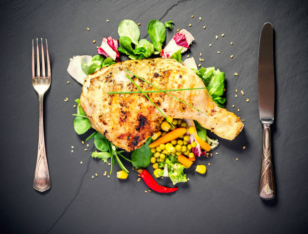 istock Grilled chicken thighs on slate plate 1170556545