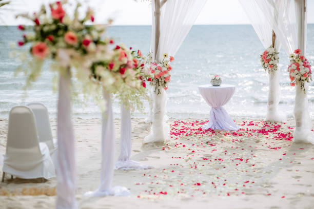 istock Romantic wedding ceremony on the beach. Wedding setting on the beach. Flowers wedding ceremony by the sea. 1170557743