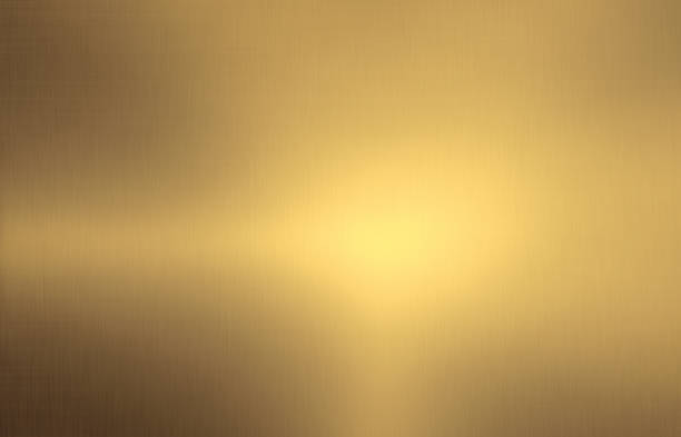 Shiny brushed gold color metal background Close up empty shiny brushed gold color metal surface texture gold metal stock pictures, royalty-free photos & images
