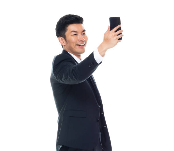 istock Attractive looking Chinese businessman - taking a selfie 1170560566