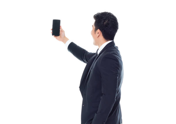istock Attractive looking Chinese businessman - taking a selfie 1170560575