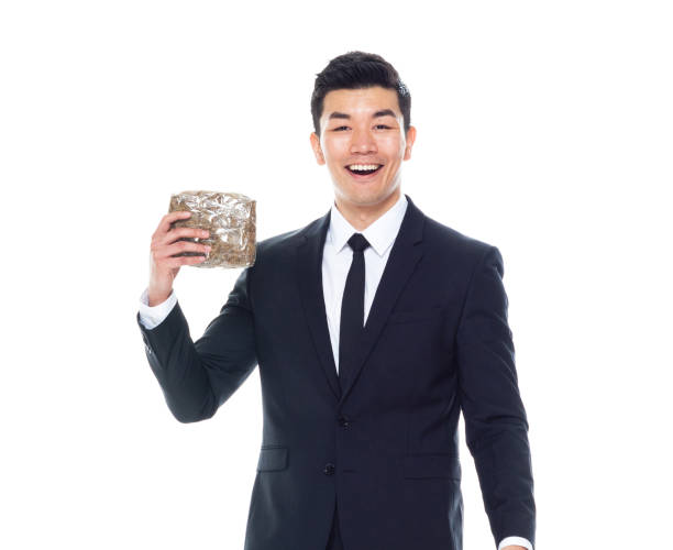 красивый азиатский бизнесмен, держащий в руках завуа - 11927 стоковые фото и изображения