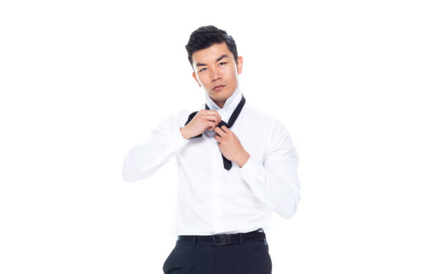 istock Handsome Asian man tying a tie 1170560932