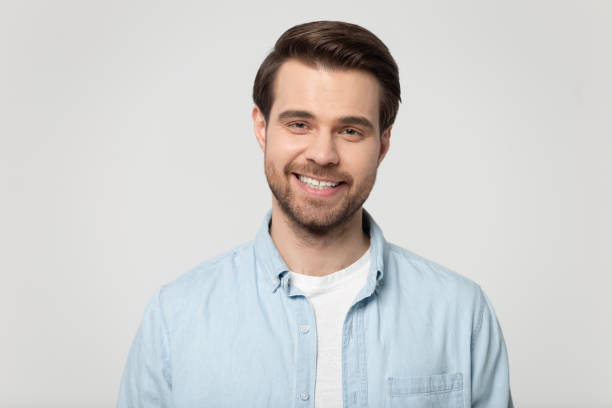 istock Headshot portrait of smiling guy isolated on grey studio background 1170564097