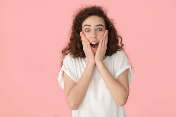 istock Woman open mouth feels amazement looking at camera studio shot 1170566467