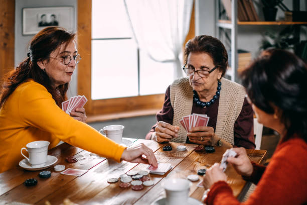 istock Active senior women playing games at home 1170566566
