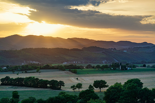 Golden summer sunset at Umbria countryside. Typical landscape in central Italy