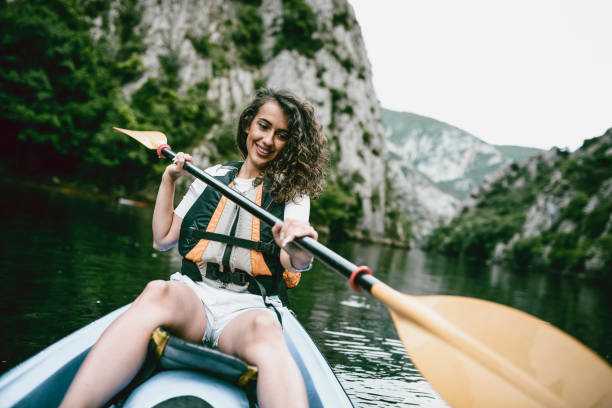 istock Cute Female Enjoying Her Kayaking Trip 1170567619
