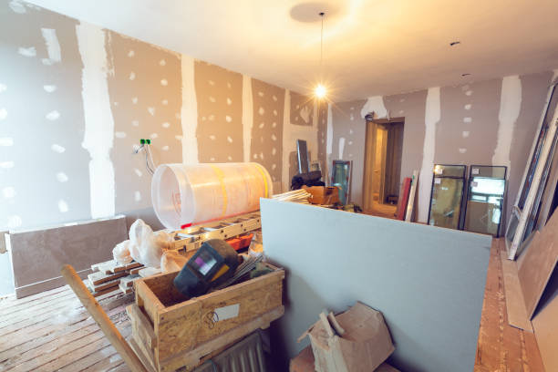 istock Working process of renovate room with installing drywall or gypsum plasterboard and construction materials are in apartment is under construction, remodeling, renovation, extension, restoration and reconstruction. Concept of home improvement or renovate 1170568519