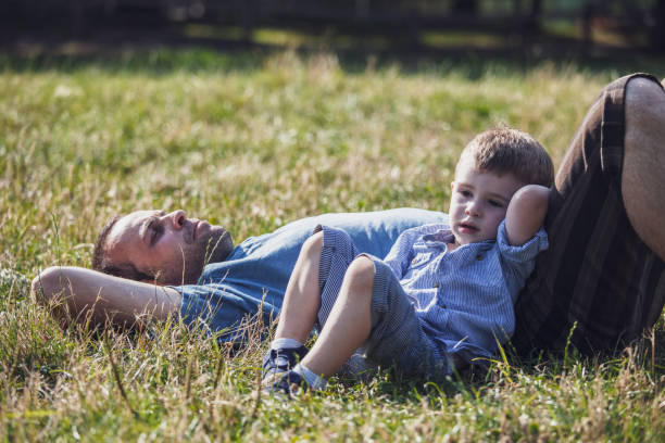 istock Single father and son hanging out outdoors 1170570073