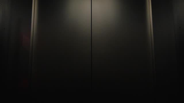 Elevator Door Opening Towards Darkness