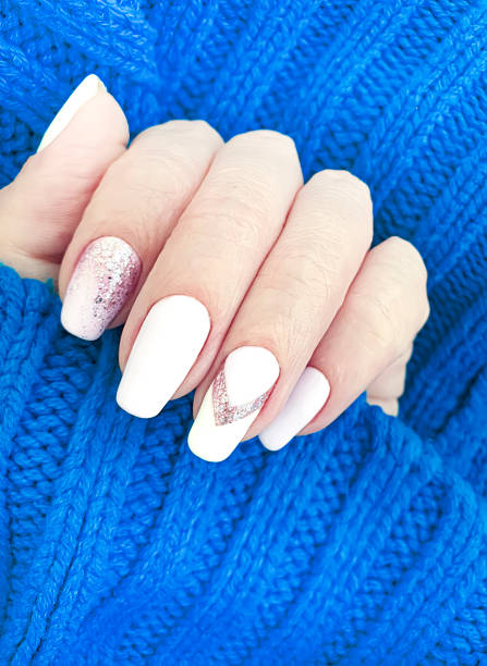 istock female hand beautiful manicure sweater 1170574832