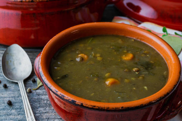 istock Lentil soup in a red clay bowl with a spoon. 1170575180