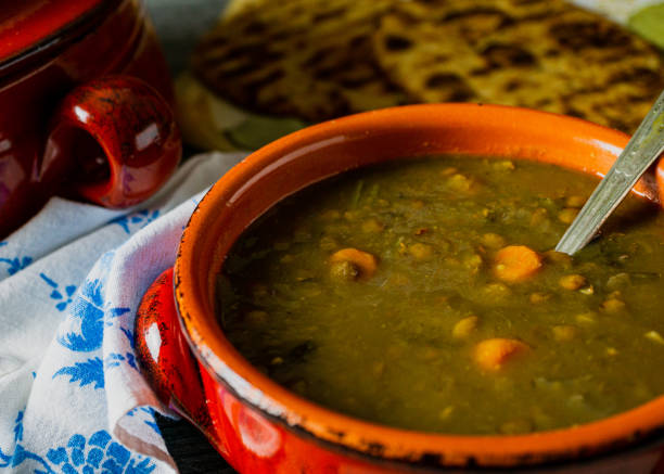 istock Lentil soup in a red clay bowl with a spoon. 1170575230