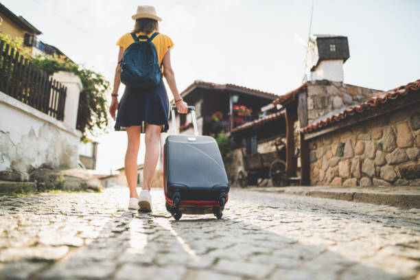 istock Tourist woman with suitcase exploring Europe 1170576201