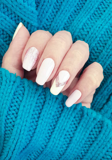 istock female hand beautiful manicure sweater 1170576563