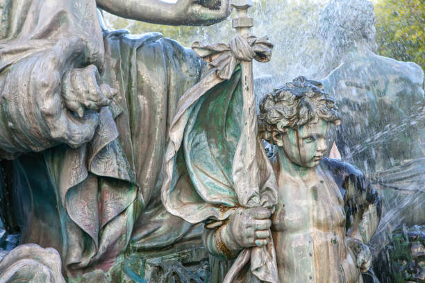 Quebec City: Large water fountain in summer on Avenue Honore Mercier with little greek boy sculptures
