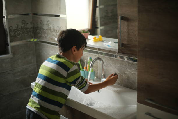 istock Little boy washing face 1170579239