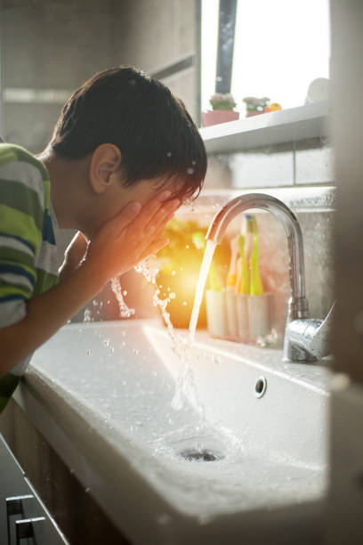 istock Little boy washing face 1170579317