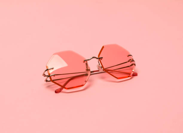 istock Creative coral trendy sunglasses on pink pastel background. 1170581399