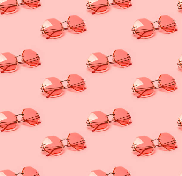 Seamless pattern with creative coral trendy sunglasses on pink pastel background