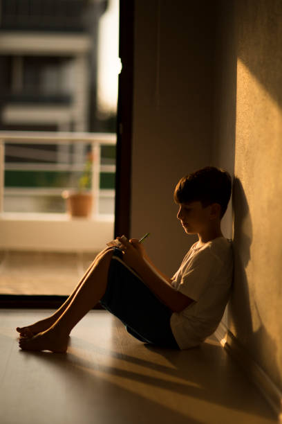 istock Cute little boy doing his homework 1170583857