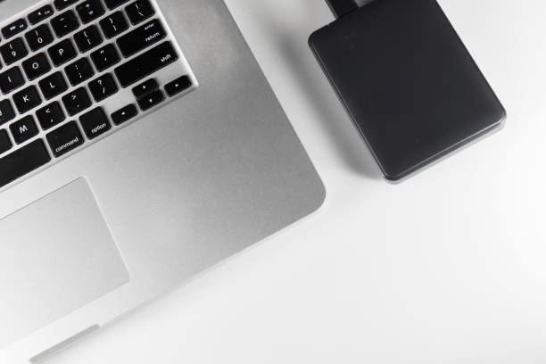 istock laptop and mobile hard drive 1170584875