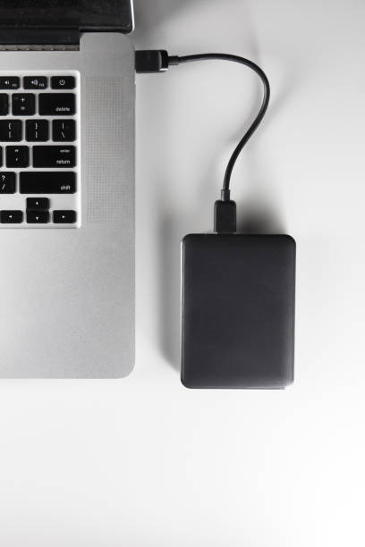 istock laptop and mobile hard drive 1170584892
