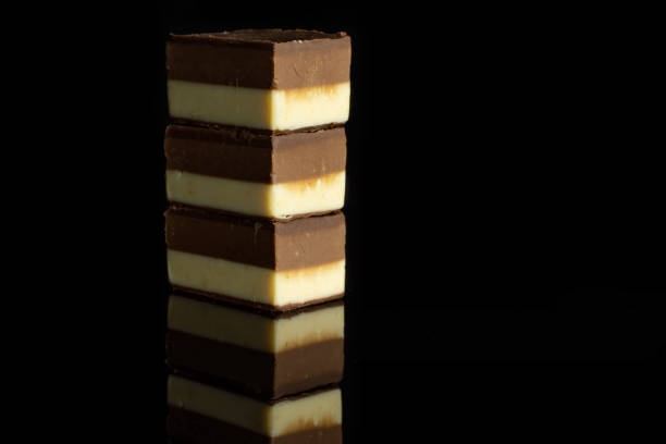Two colours nougat isolated on black glass