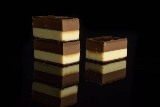 istock Two colours nougat isolated on black glass 1170586536