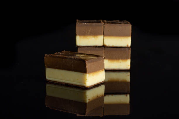istock Two colours nougat isolated on black glass 1170586579