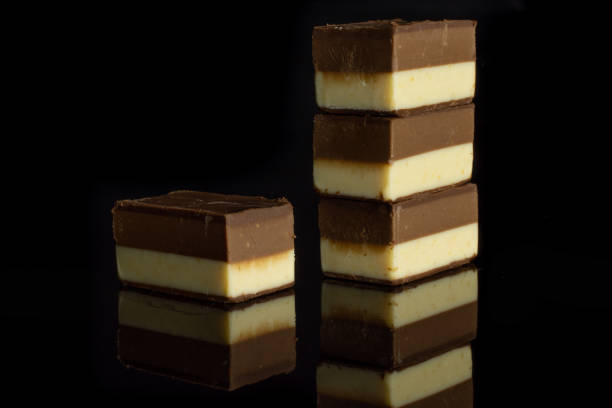 Two colours nougat isolated on black glass
