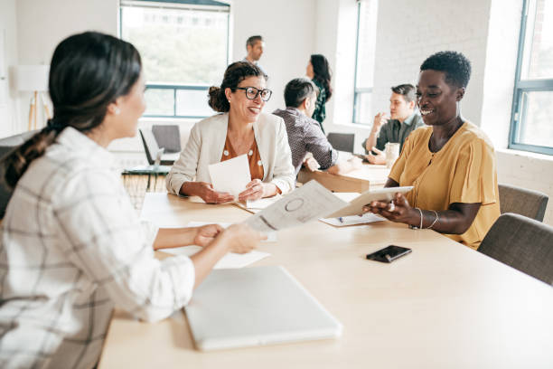 istock Multi-ethnic group negotiating  in a coworking space 1170597585