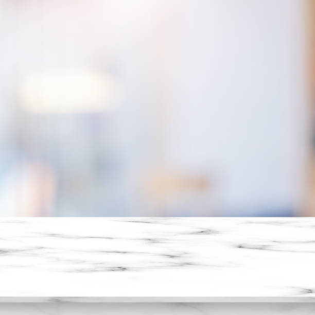 istock abstract blurred inside modern loft living room in scandinavia decorative style background with white marble pattern tabletop for show, promote ads and design product on display concept 1170598748