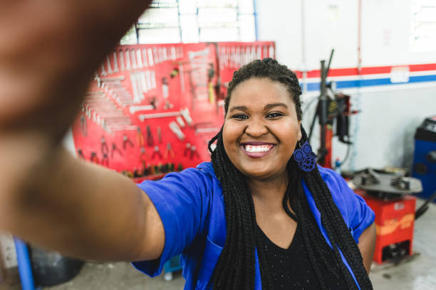 istock Mechanical woman taking a selfie at work 1170599782