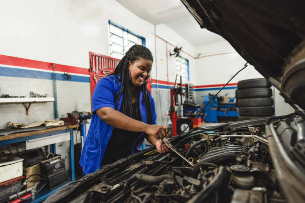 istock Woman mechanic working on a car engine 1170599799