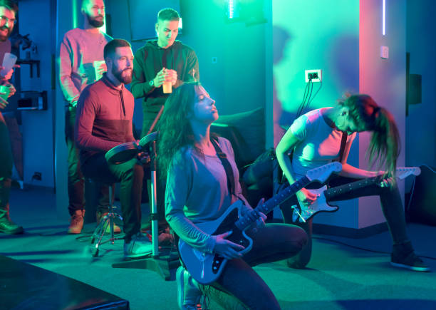 istock Multi-Ethnic Group at the amusement arcade playing rhythm games, music games 1170600727