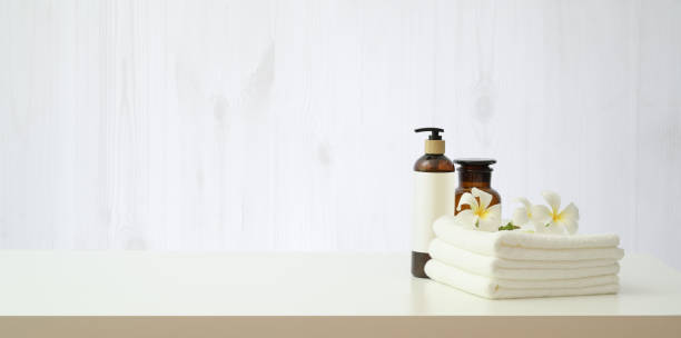 istock Spa setting with plumeria flower and essential oil bottle 1170616730