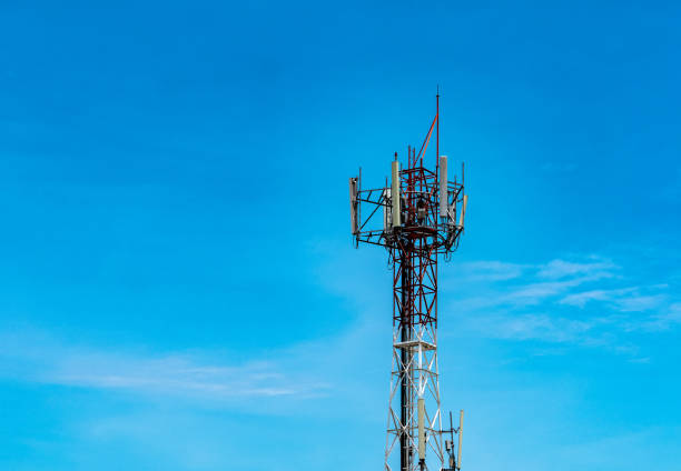 istock Telecommunication tower with blue sky and white clouds background. Antenna on blue sky. Radio and satellite pole. Communication technology. Telecommunication industry. Mobile or telecom 4g network. 1170617647