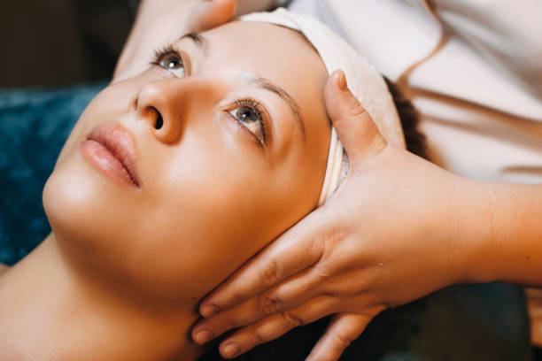 istock Close up of a charming caucasian woman leaning on a spa bed with eyes opened while having skin care routine in a wellness spa resort. 1170617951
