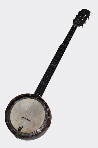 6 string banjo on grey background
